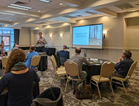 California Climate Hub Director Steven Ostoja speaks to the gathered experts at the Climate-Informed Reforestation Workshop.