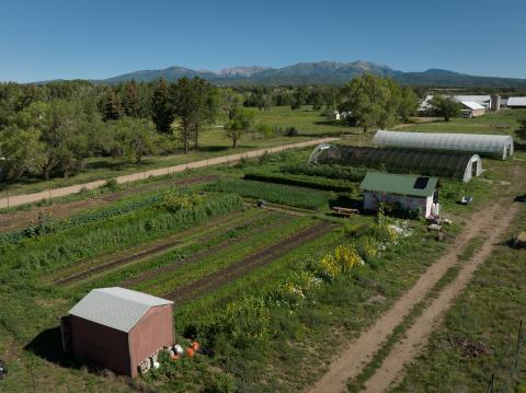 The Old Fort’s Education Garden pictured from above with the backdrop of the La Plata Mountains