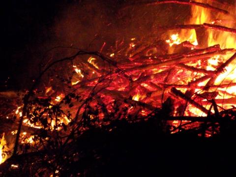 brush pile fire at night